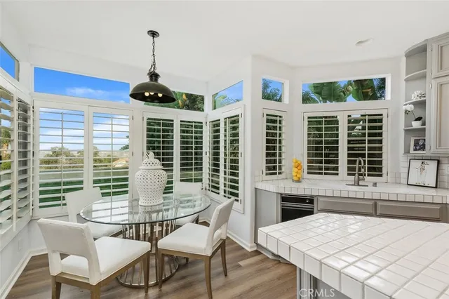 a dining room with a window and furniture