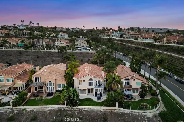 a front view of a house with patio and garden