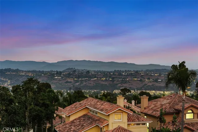 a view of a patio with chairs and table in the patio
