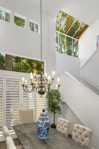 a view of a vase of flowers sitting on a floor