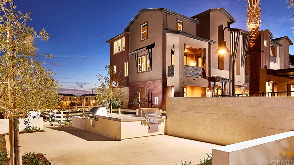 7399 Solstice Place Rancho Cucamonga, CA 91739 - Photo 1 of 1 a view of a building with many windows