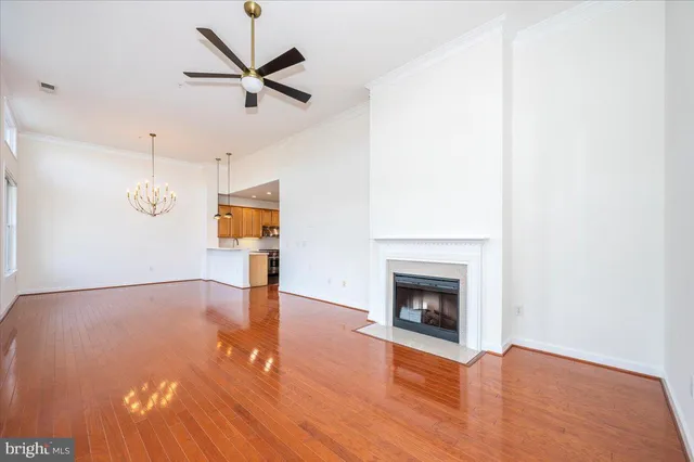 a view of an empty room with a fireplace