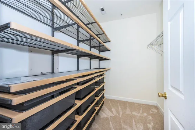 a bathroom with a double vanity sink toilet and shower