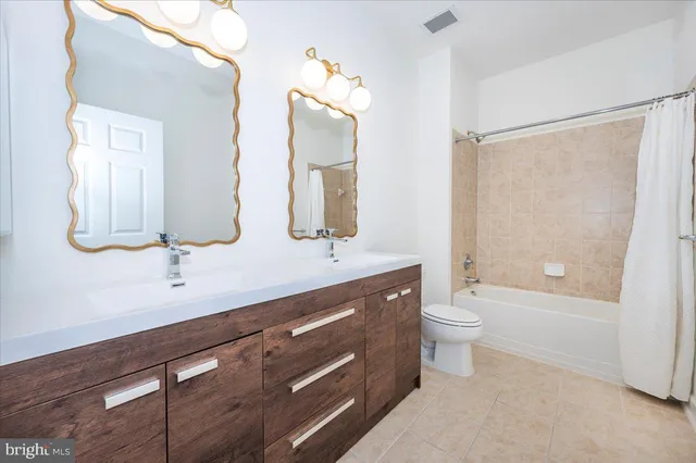 a bathroom with a shower and a bath tub