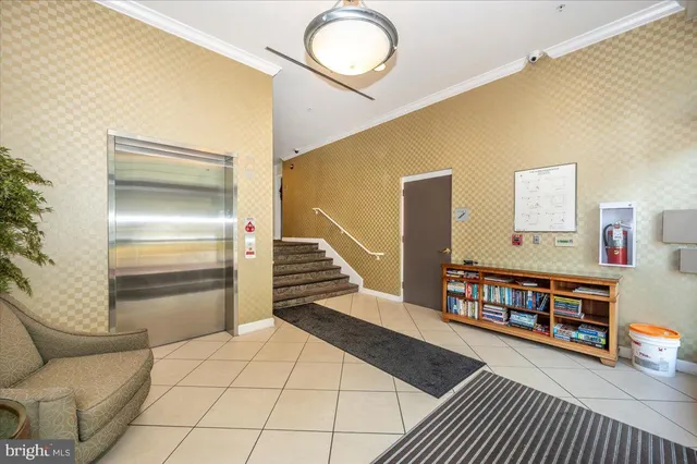 a bedroom with furniture and a book shelf