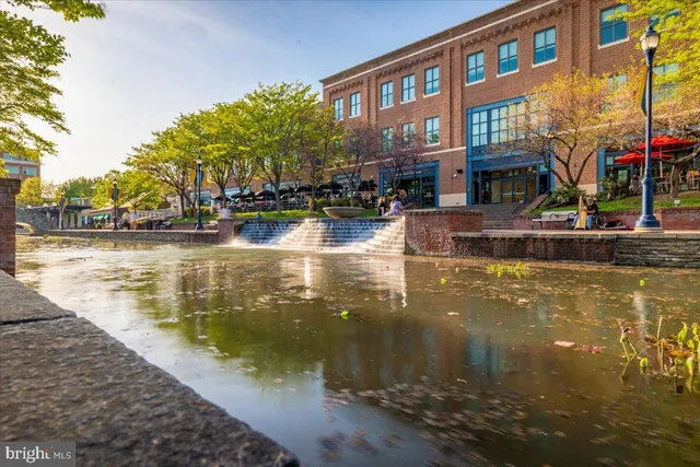 a outdoor space with lots of chairs and a table