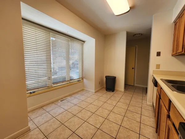 a view of an empty room with a ceiling fan