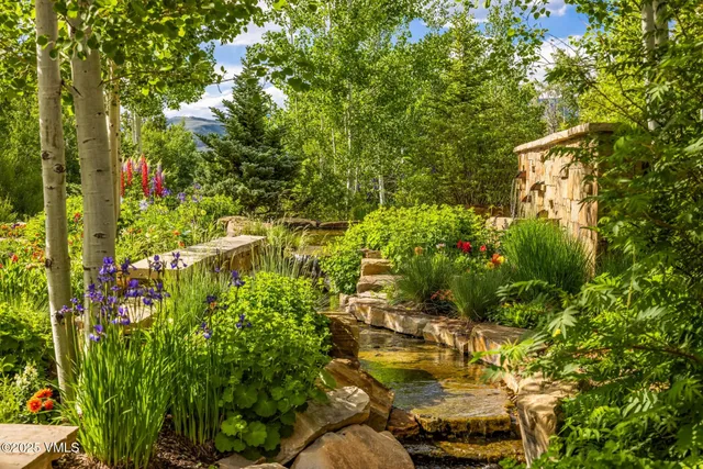 a living room with fireplace furniture and a flat screen tv