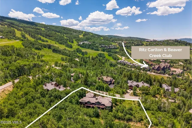 a living room with a fireplace and a flat screen tv