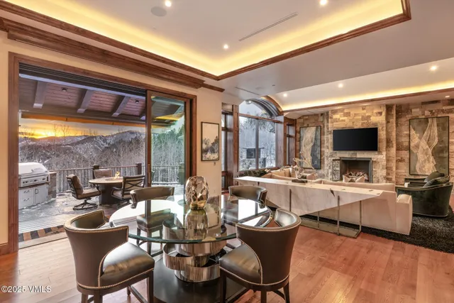a view of a living room and kitchen with a large window