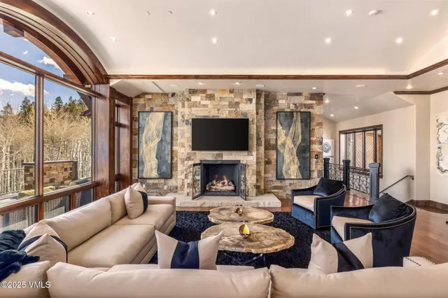 a balcony with furniture and wooden floor