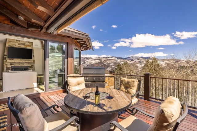 a living room with fireplace furniture and a floor to ceiling window
