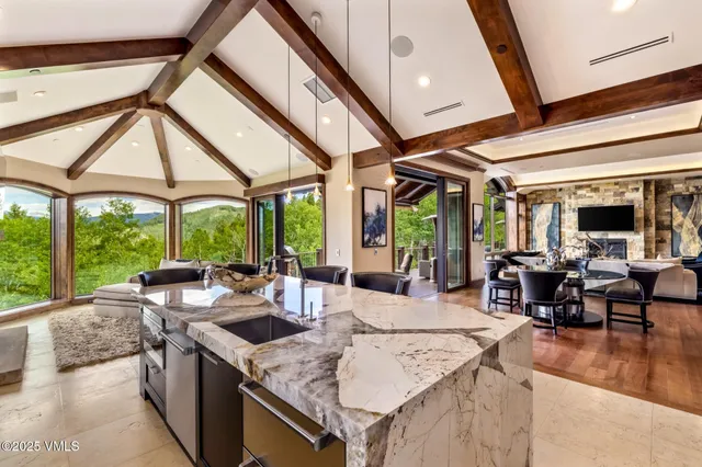 a bathroom with a granite countertop sink mirror vanity and toilet