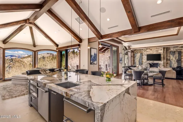 a spacious bedroom with a bed and a flat screen tv