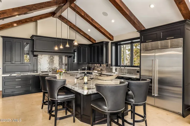 a view of an chairs and table in a room