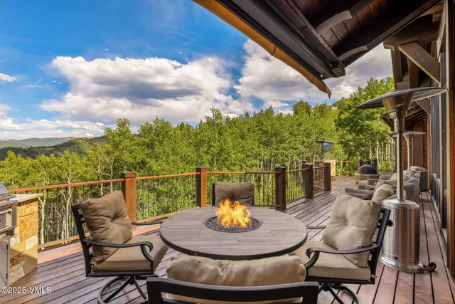 a view of a house with a yard and lake view