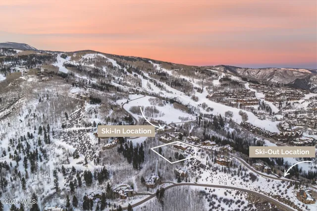 a living room with furniture a flat screen tv and a floor to ceiling window