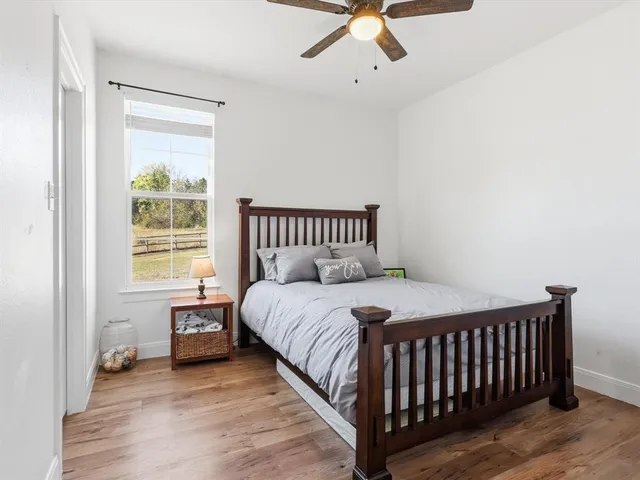 a bathroom with a double vanity sink mirror and shower