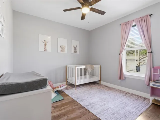 a living room with a couch a table and a barbeque