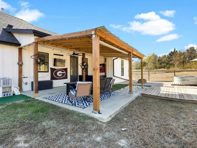 a view of a backyard with sitting area