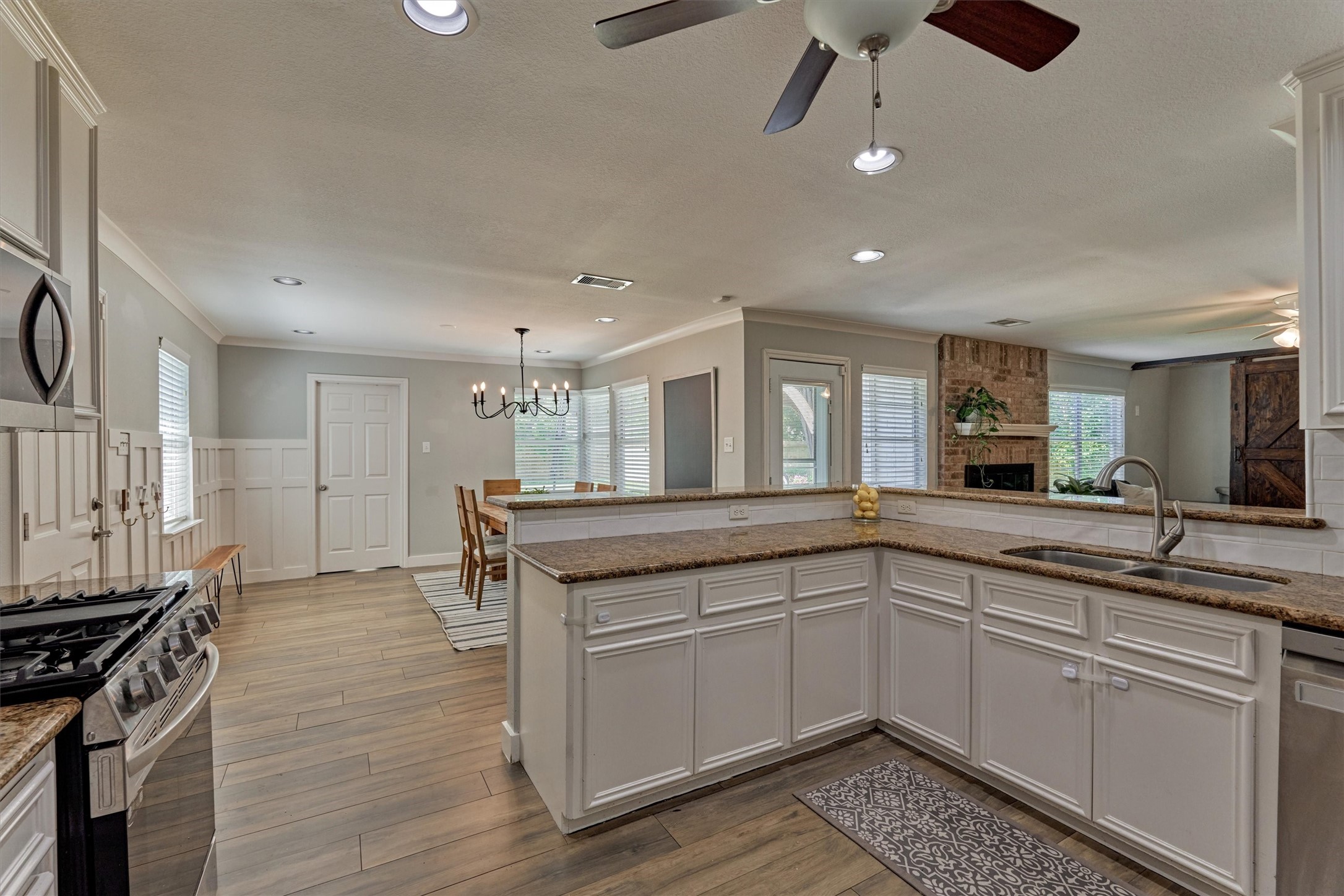 6515 Glenhill Drive Spring, TX 77389 - Photo 9 of 39 a kitchen with a sink and stove
