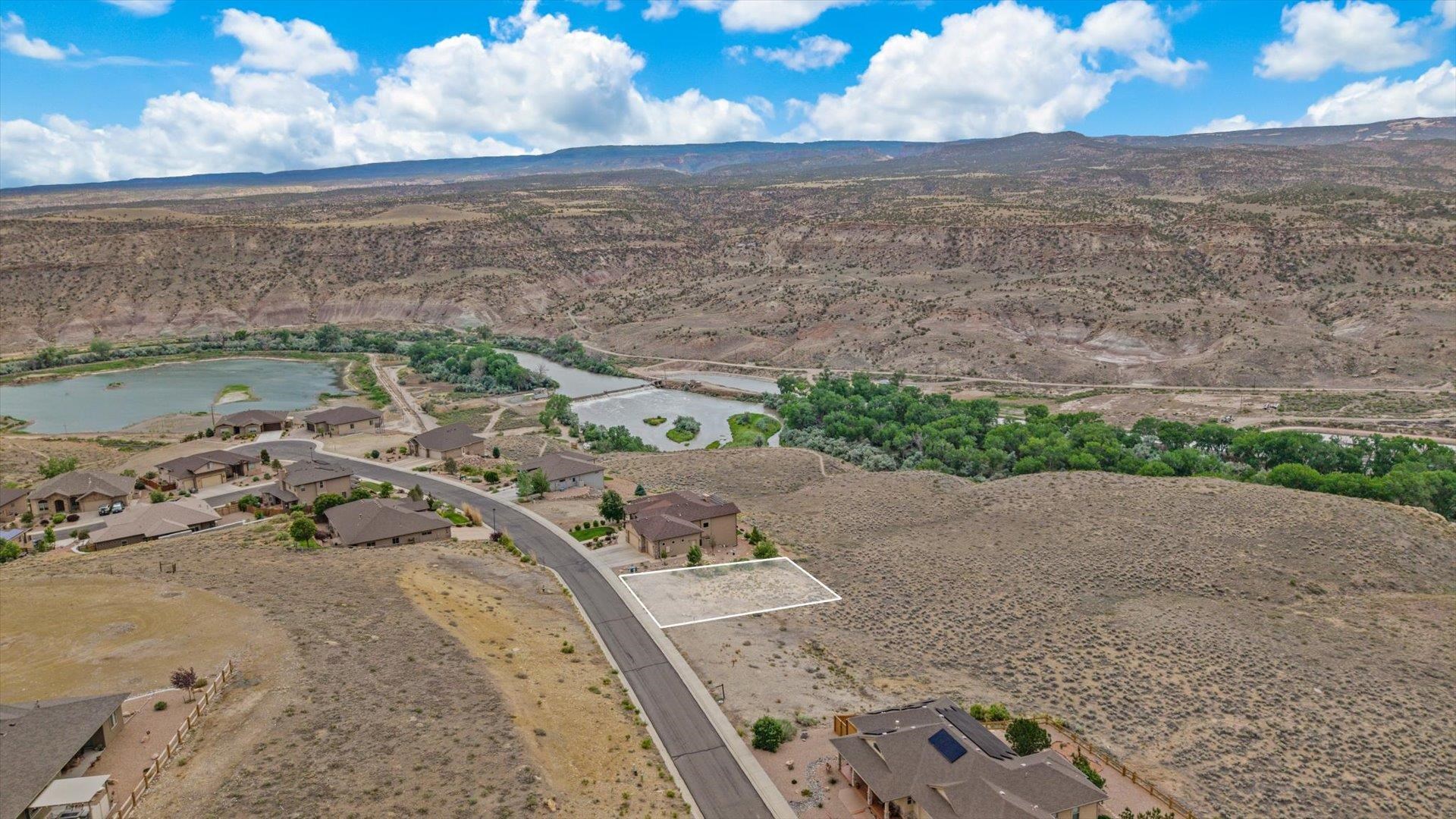 195 River Ridge Drive Grand Junction, CO 81503 - Photo 5 of 5 a view of a lake with beach