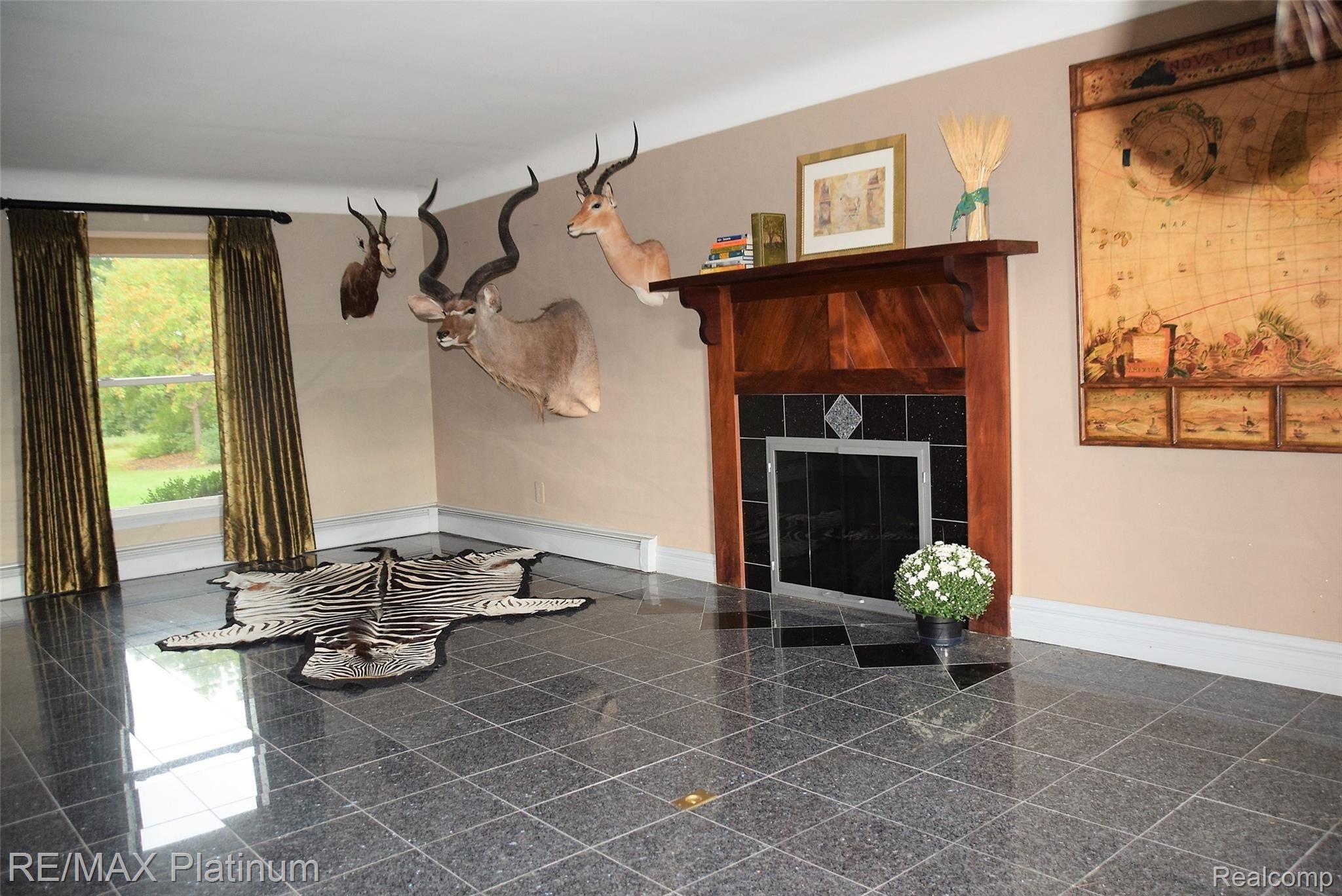 7525 Fisher Road Howell, MI 48855 - Photo 13 of 54 Living room with gas fireplace.JPG