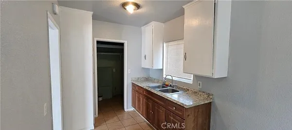 a kitchen with stainless steel appliances granite countertop a stove and a refrigerator