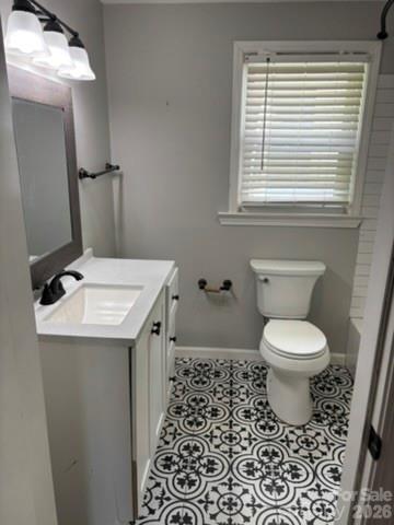 229 Browntown Road Belmont, NC 28012 - Photo 15 of 23 a bathroom with a toilet a sink and a window