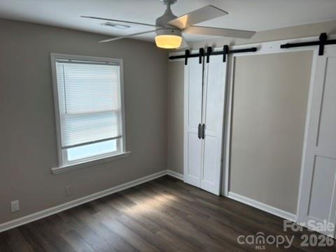 229 Browntown Road Belmont, NC 28012 - Photo 18 of 23 a view of an empty room with wooden floor and a window