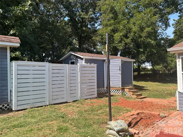 a house view with a backyard space