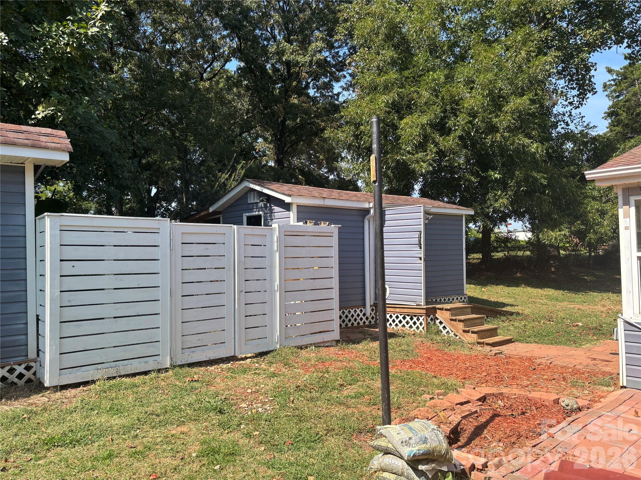 229 Browntown Road Belmont, NC 28012 - Photo 22 of 23 a house view with a backyard space