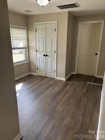 229 Browntown Road Belmont, NC 28012 - Photo 3 of 23 an empty room with wooden floor and windows