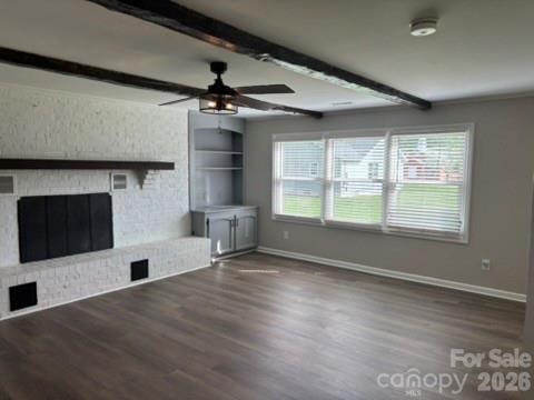 229 Browntown Road Belmont, NC 28012 - Photo 10 of 23 a view of a livingroom with a flat screen tv wooden floor and a ceiling fan