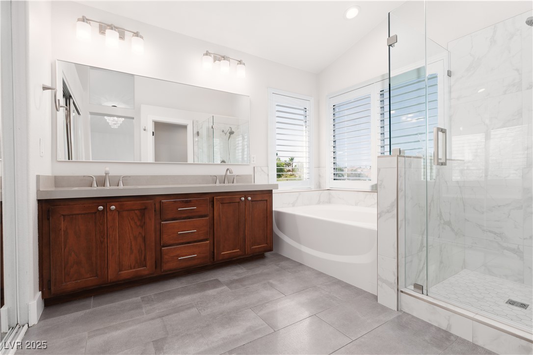 7837 Fort Ruby Place Las Vegas, NV 89128 - Photo 19 of 50 Full bathroom with a garden tub, a marble finish shower, and double vanity