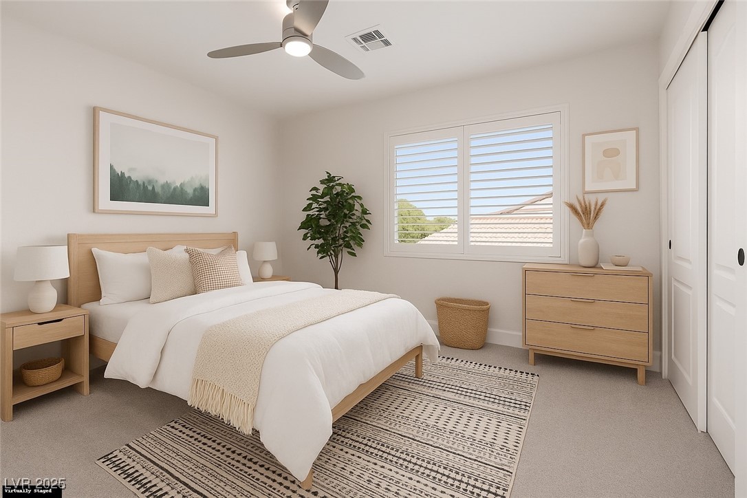 7837 Fort Ruby Place Las Vegas, NV 89128 - Photo 23 of 50 Virtually Staged Bedroom featuring light colored carpet, a closet, and a ceiling fan