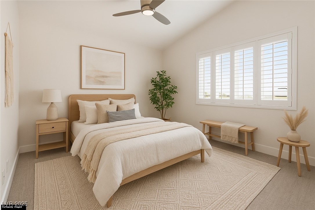 7837 Fort Ruby Place Las Vegas, NV 89128 - Photo 25 of 50 Virtually Staged Bedroom with lofted ceiling, light carpet, and a ceiling fan