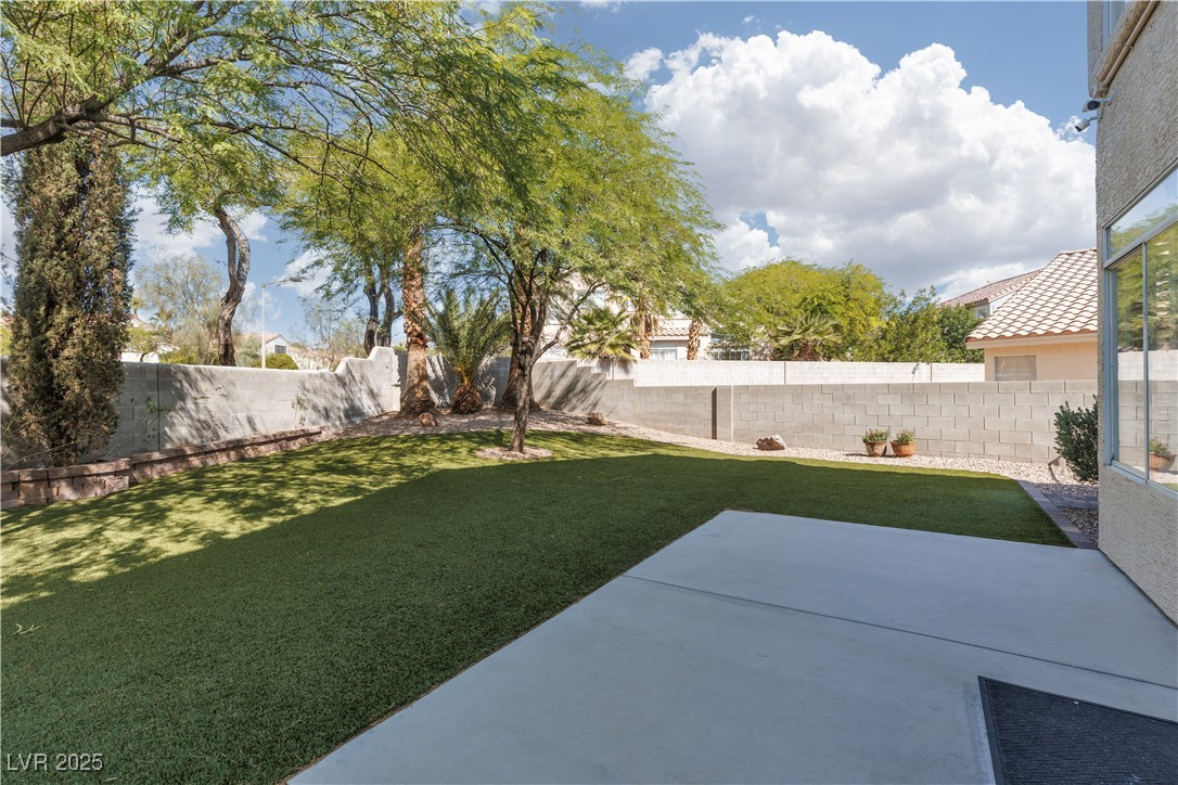 7837 Fort Ruby Place Las Vegas, NV 89128 - Photo 31 of 50 View of yard featuring a patio area