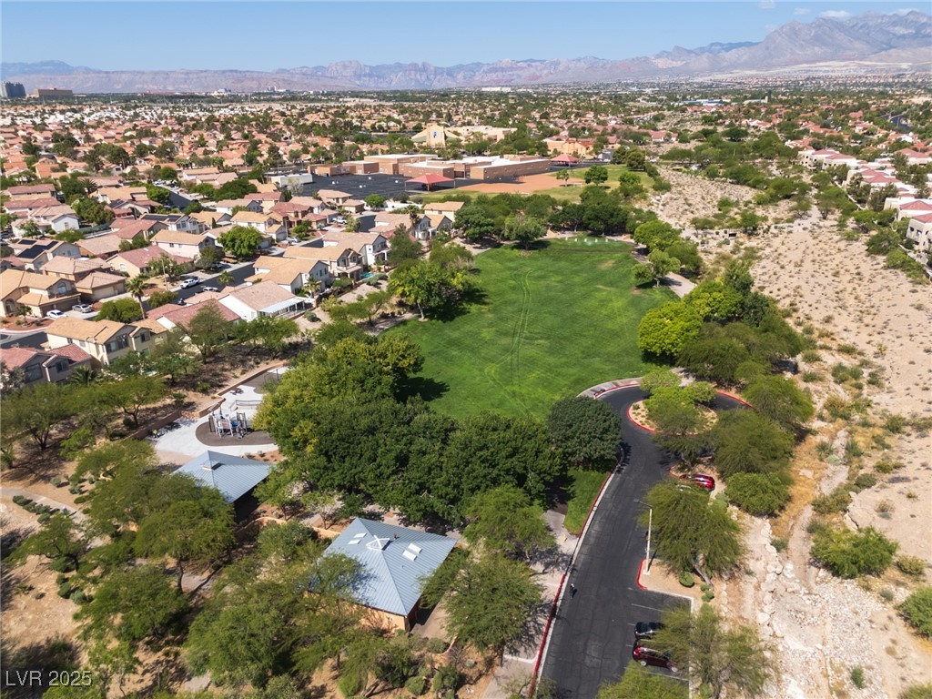 7837 Fort Ruby Place Las Vegas, NV 89128 - Photo 41 of 50 Aerial overview of property's location featuring a mountainous background and nearby suburban area