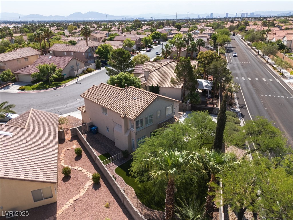 7837 Fort Ruby Place Las Vegas, NV 89128 - Photo 44 of 50 Aerial view of residential area featuring a mountain backdrop