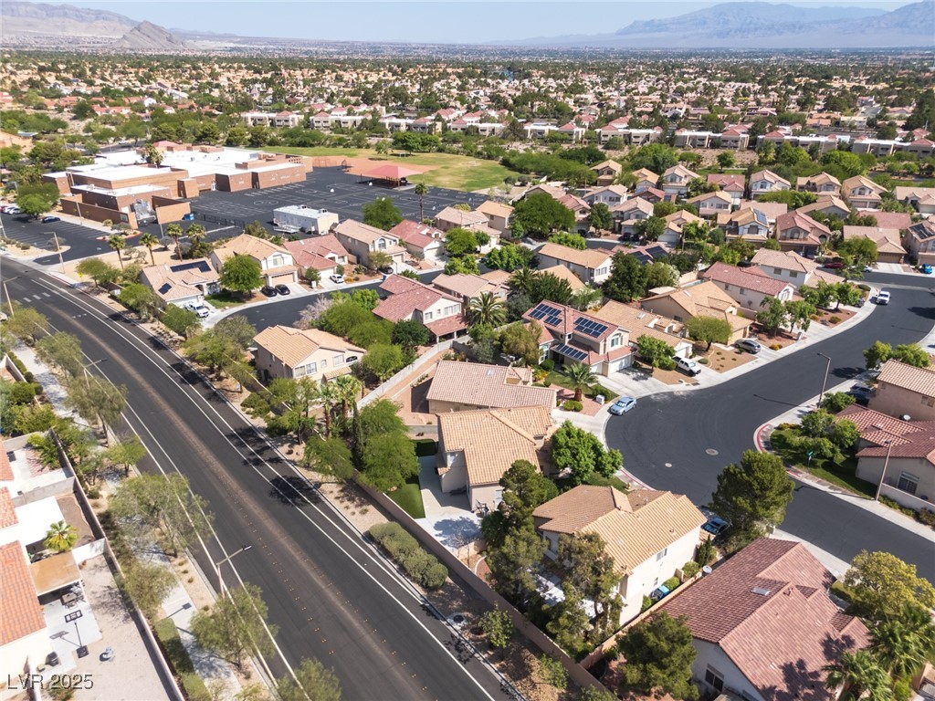 7837 Fort Ruby Place Las Vegas, NV 89128 - Photo 46 of 50 Aerial perspective of suburban area featuring a mountain backdrop