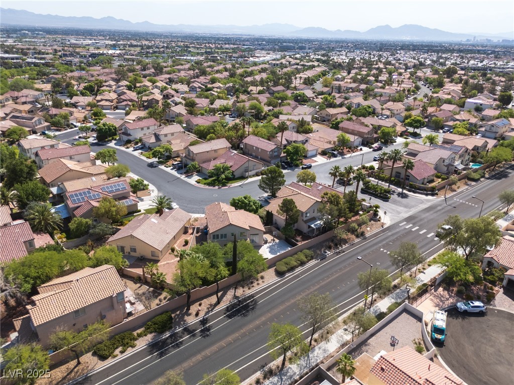 7837 Fort Ruby Place Las Vegas, NV 89128 - Photo 47 of 50 Aerial perspective of suburban area featuring a mountainous background