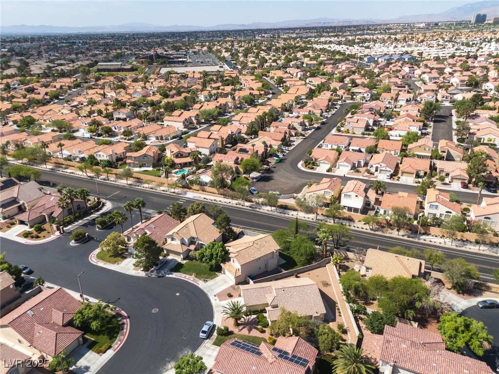 7837 Fort Ruby Place Las Vegas, NV 89128 - Photo 49 of 50 Aerial view of property and surrounding area with nearby suburban area and mountains