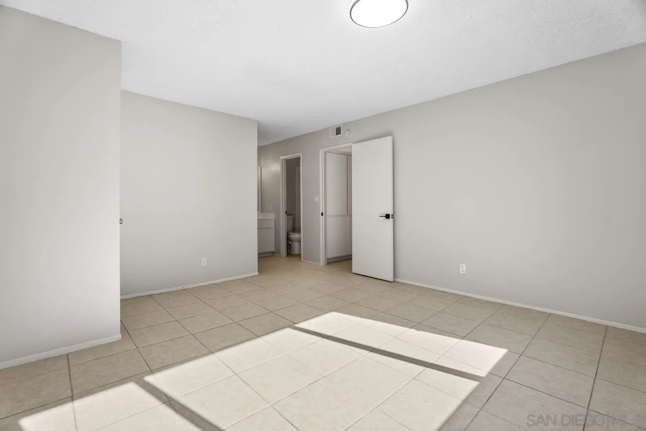 6775 Alvarado Road, Unit 10 San Diego, CA 92120 - Photo 11 of 22 an empty room with an entryway