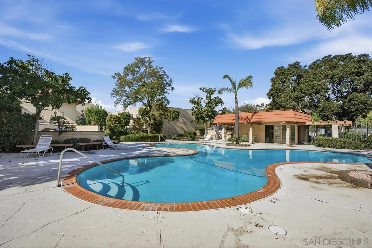 6775 Alvarado Road, Unit 10 San Diego, CA 92120 - Photo 15 of 22 a view of a swimming pool with lounge chair