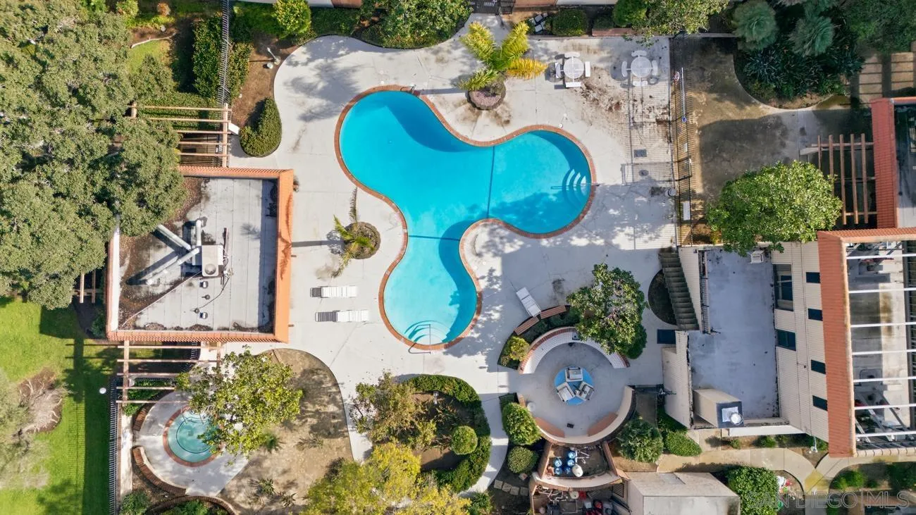 6775 Alvarado Road, Unit 10 San Diego, CA 92120 - Photo 18 of 22 an aerial view of a swimming pool patio and outdoor seating