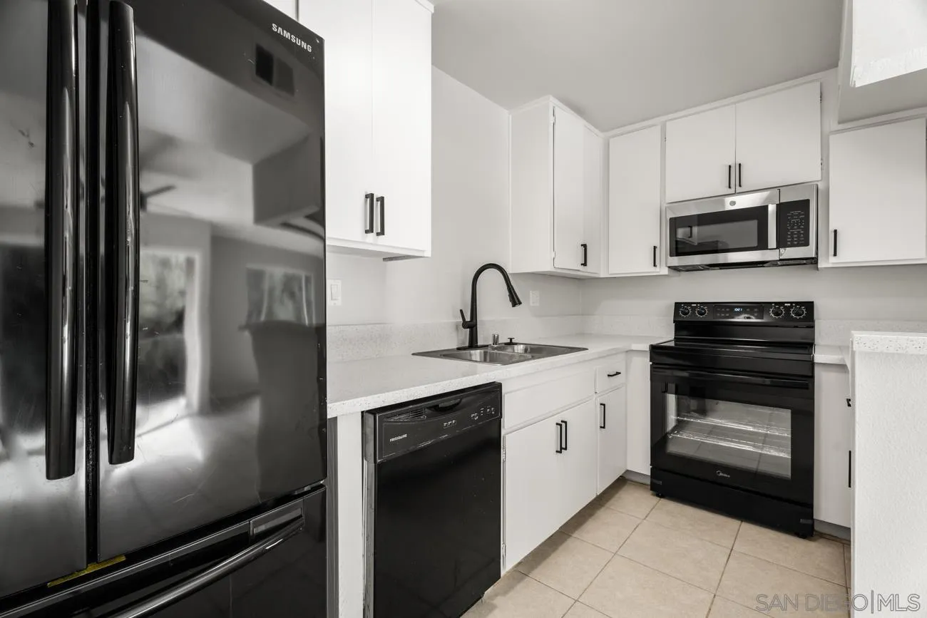 6775 Alvarado Road, Unit 10 San Diego, CA 92120 - Photo 7 of 22 a kitchen with a sink and stainless steel appliances