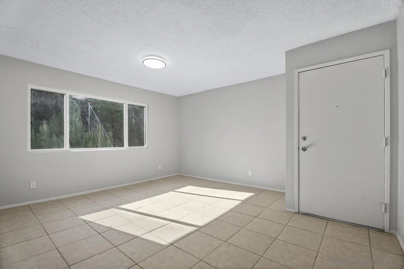 6775 Alvarado Road, Unit 10 San Diego, CA 92120 - Photo 10 of 22 a view of an empty room with a window