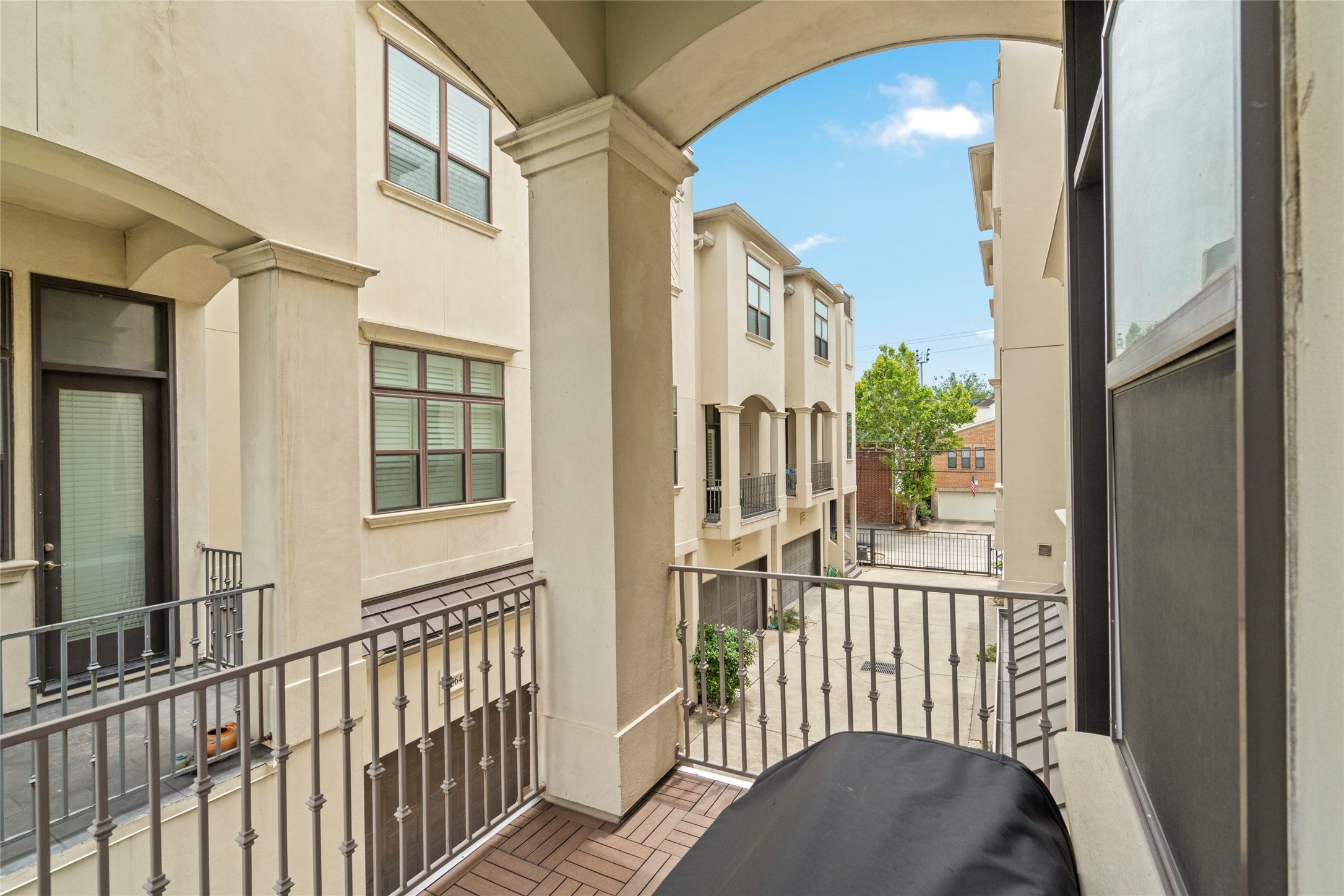 5646 Larkin Street Houston, TX 77007 - Photo 8 of 29 A large balcony off the main living space creates an added area for hosting, lounging, or grilling.