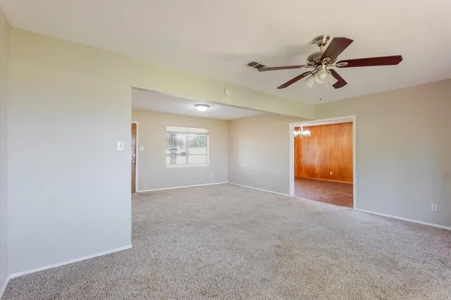 an empty room with windows and entrance